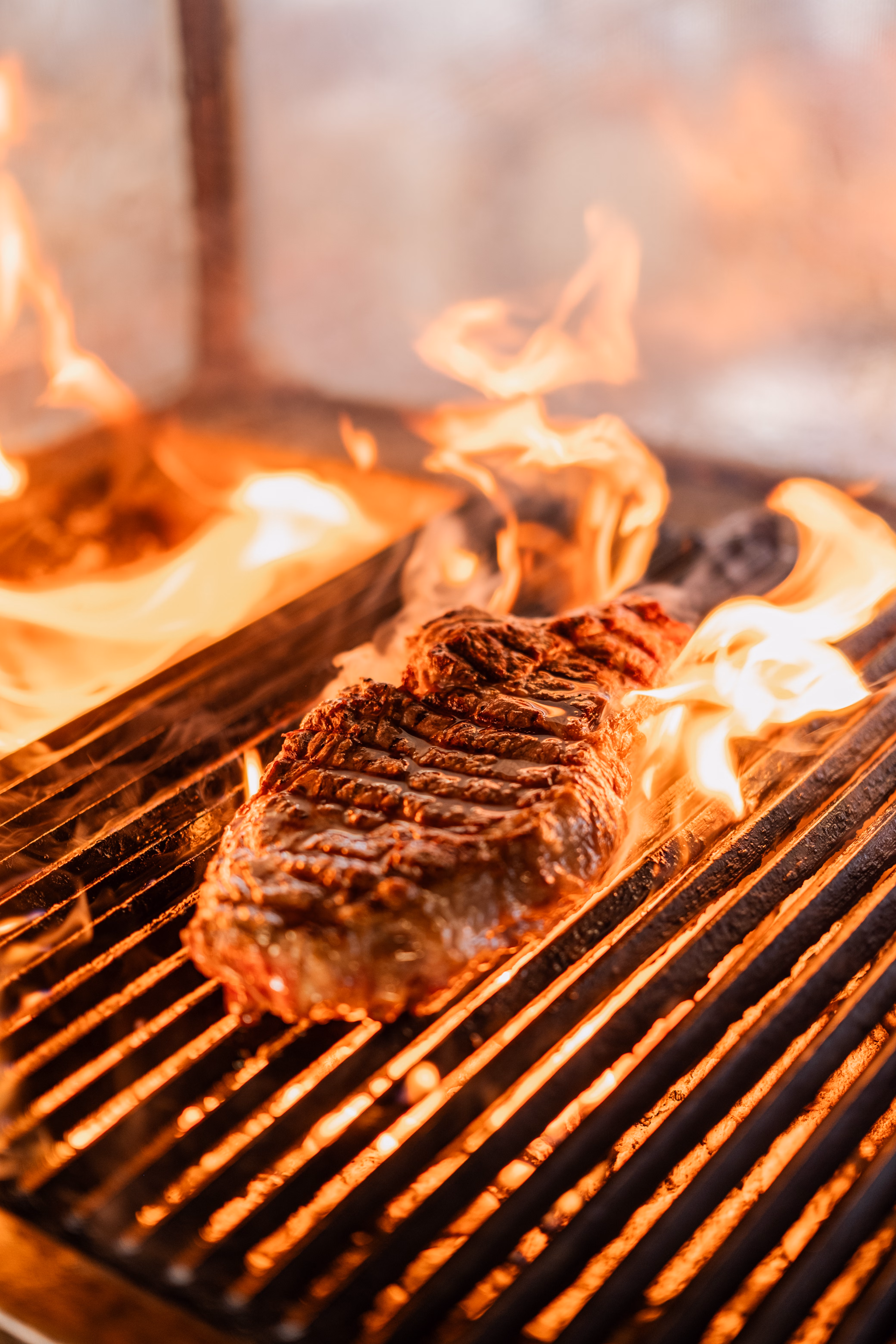 Spit braai roasting over open coals